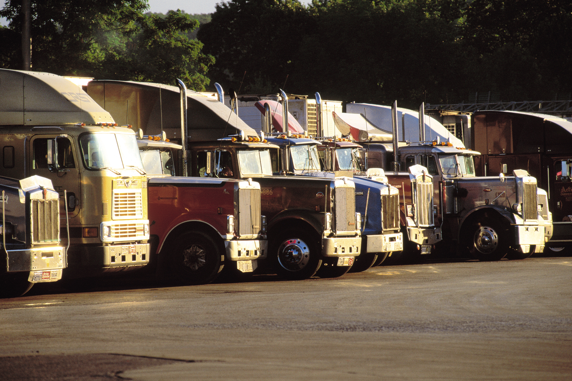 Semi-trucks parked in a row