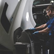 heavy duty truck technician examining a truck