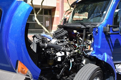 Inside look under front hood of kenworth truck