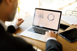 Man Looking At Computer Data