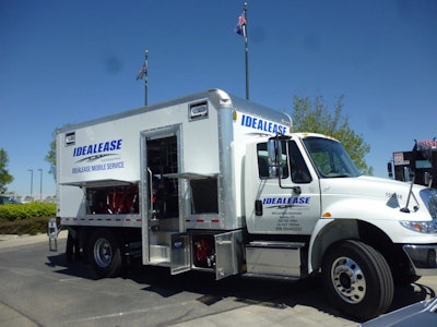An Idealease mobile repair truck with hatches and doors opened, showing the tools inside.