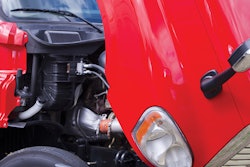 red semi truck with hood lifted
