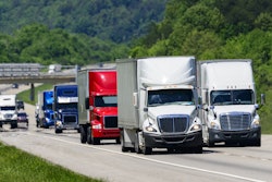 Semi trucks and cars on highway