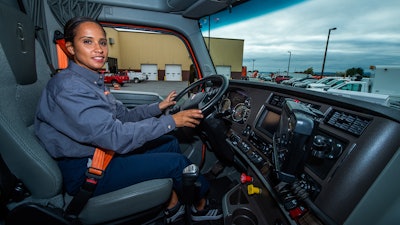 East Penn driver behind the wheel of a heavy duty truck.