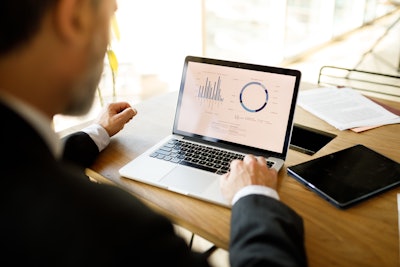 Man Looking At Computer Data