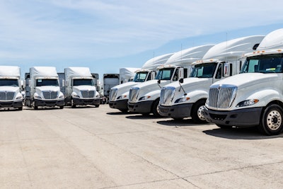 Group of white used International trucks