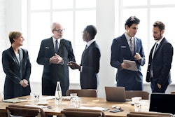 Executives at negotiating table