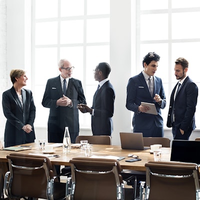 Executives at negotiating table