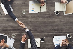 Executives at negotiating table