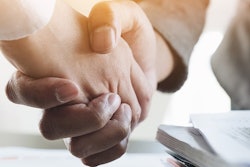 Two people shaking hands