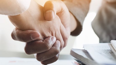 Two people shaking hands