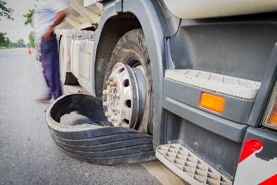 Truck with flat tire roadside