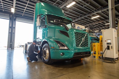 TEC Equipment technician servicing a Volvo VNR electric