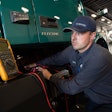 TEC Equipment technician servicing a Volvo VNR electric