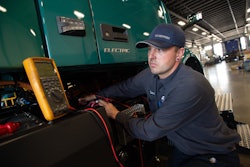 TEC Equipment technician servicing a Volvo VNR electric