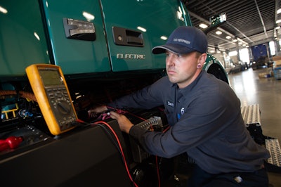 TEC Equipment technician servicing a Volvo VNR electric
