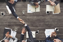 Executives at negotiating table