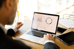 Man looking at computer data