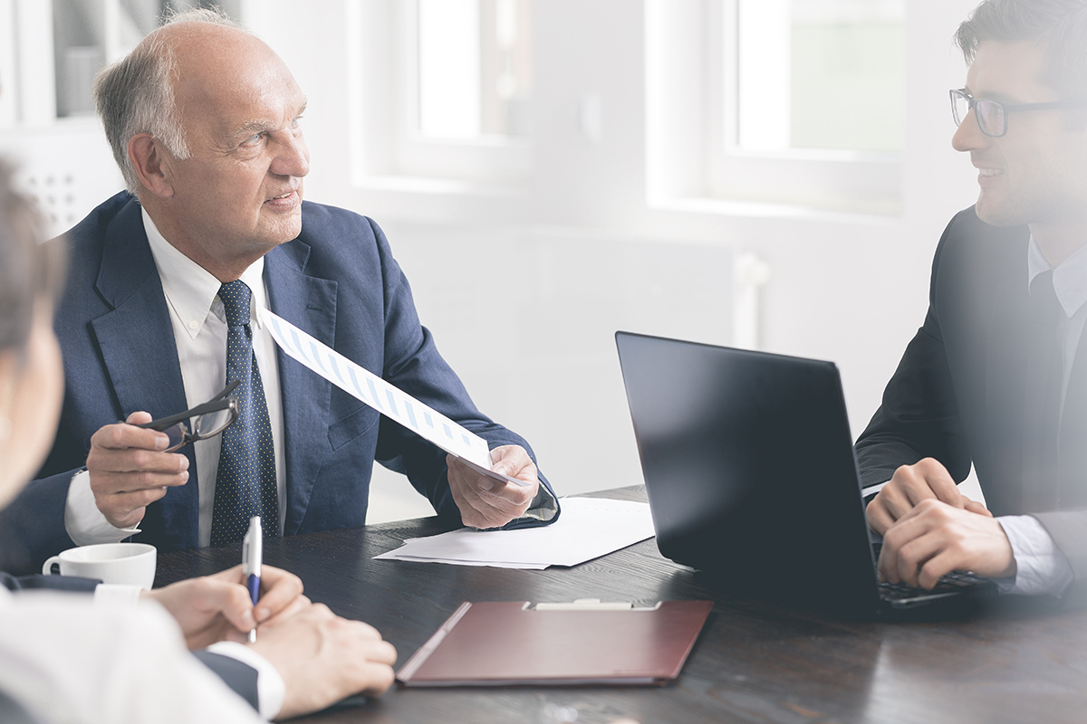 Executives sitting at a desk