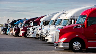 Trucks parked in a lot.