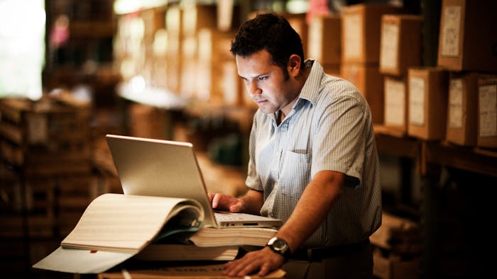 Warehouse worker on laptop