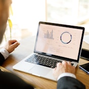 Man looking at computer data