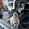 Volvo technician working on a truck.