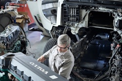 Volvo technician working on a truck.