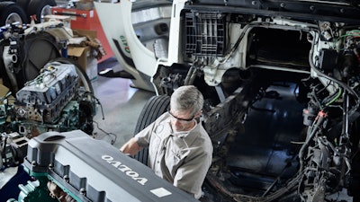 Volvo technician working on a truck.