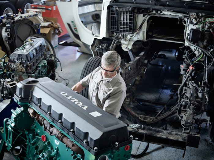 Volvo technician working on a truck.