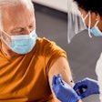 man receiving vaccine shot