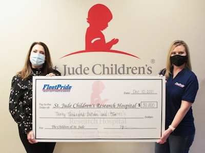 Victoria Roberts of FleetPride presenting Amy Weidner of St. Jude Children’s Research Hospital a check for $30,0000.