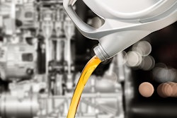 Pouring motor oil from bottle.