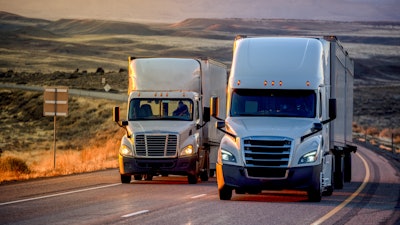 Two used trucks on highway