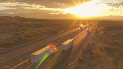 Trucks ascending toward light