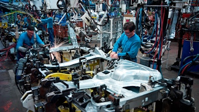 Workers in manufacturing facility