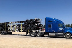 Stoughton trailer chassis stacked up on truck.