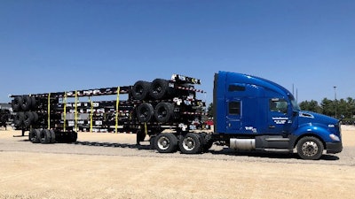 Stoughton trailer chassis stacked up on truck.