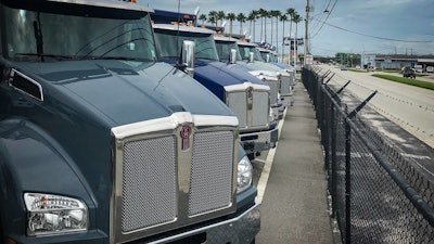 Kenworth trucks in a row