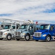 Kenworth trucks in a row