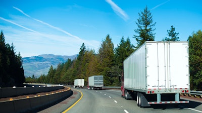 Trio of trailers on highway