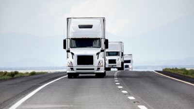 Three trucks on roadway