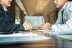 businessmen meeting face to face