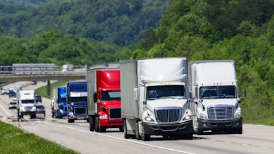 Several trucks on roadway