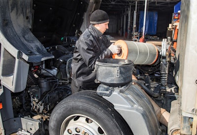 Technician working on a truck