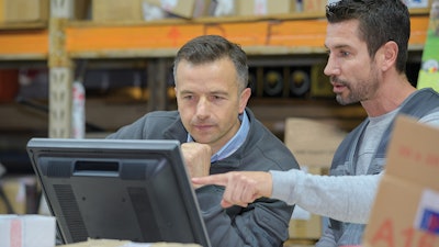 Employees looking at computer