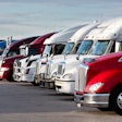 Line of used trucks in lot