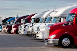 Line of used trucks in lot