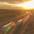 Trucks driving down highway