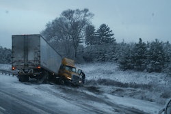 Truck on side of the road with frame damage